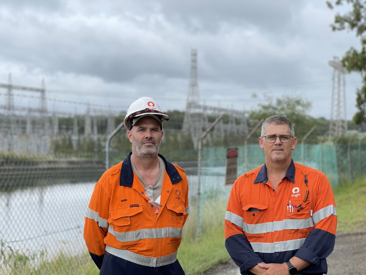 Victorian MEU members from origin Energy standing in front of power station