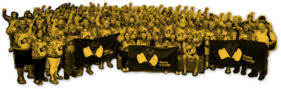 Mining and Energy Union members standing in front of a union flag with their fists raised in the air