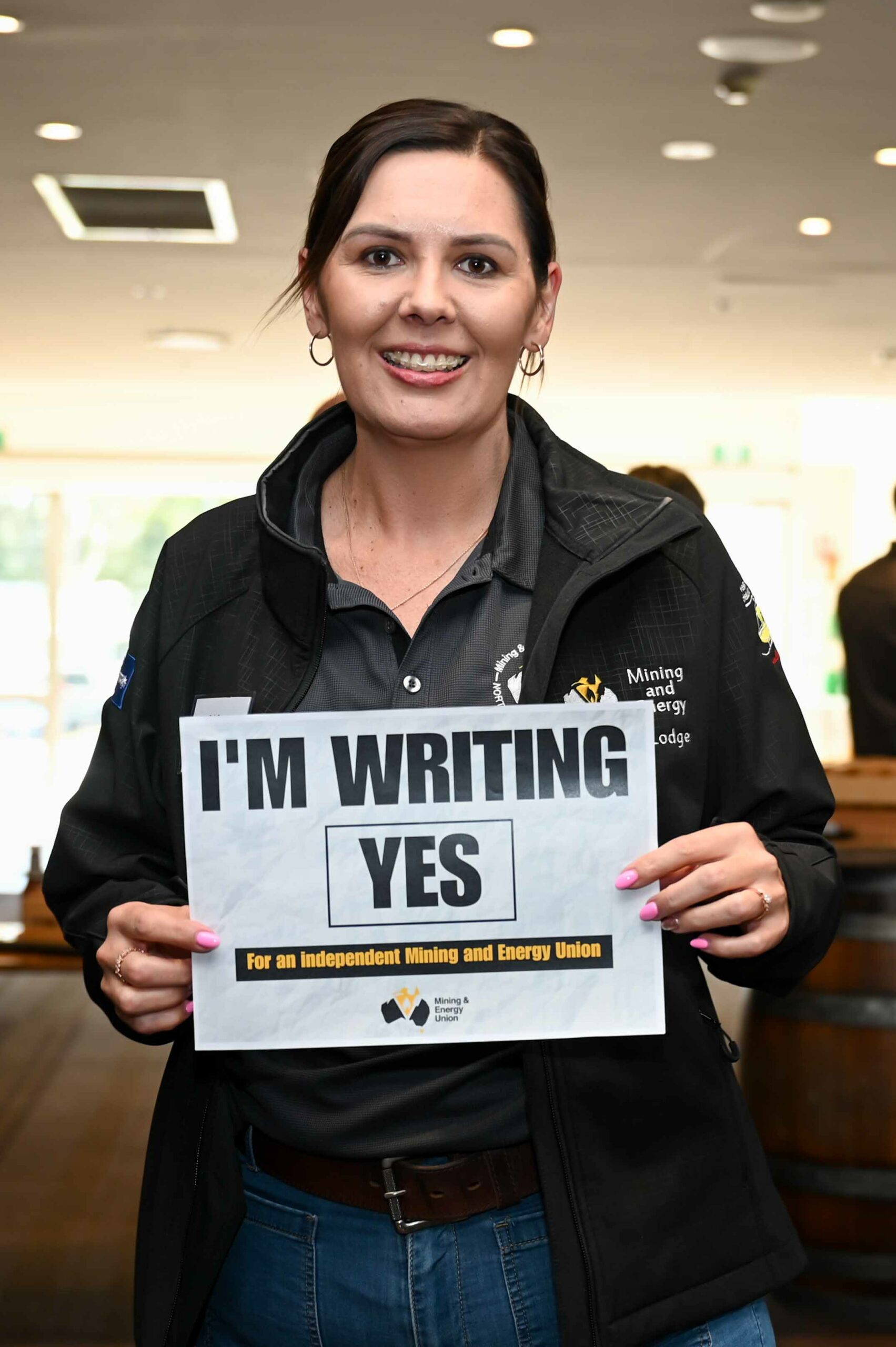 MEU Member holding a sign saying 'I'm writing yes'