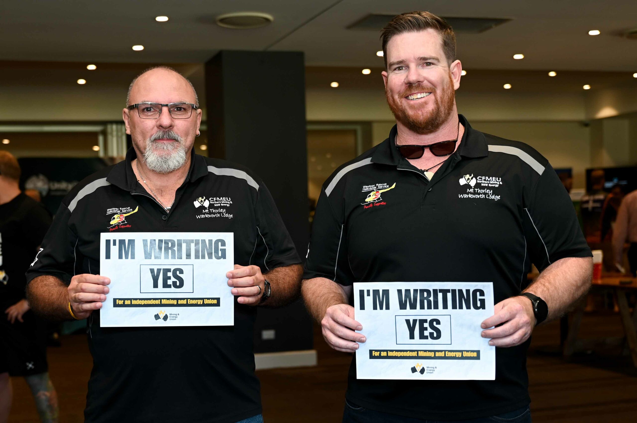 MEU Member holding a sign saying 'I'm writing yes'