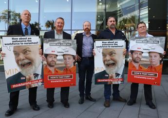 5 men holding anti BHP corflutes