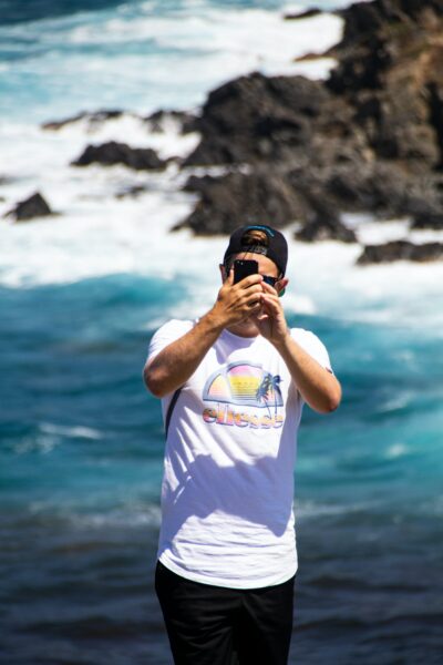 A person taking a selfie at the beach